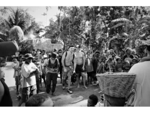 The first tourists on Sanaroa Island walking to a village to witness cultural performances