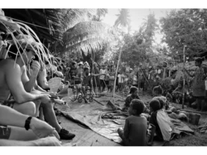 First tourists on Sanaroa Island listening to a lecture from an elder on the Kula Trading Tradition at Newsite village.