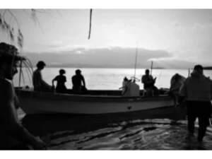 First tourists on Sanaroa Island preparing to return to the liveaboard near Kaluwana Island from Sanaroa Island