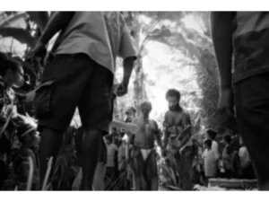 Local Bwabwasai men leading the sago making experience for tourists on Sanaroa Island