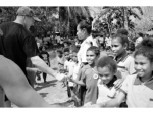 The first tourists on Sanaroa Island meeting primary school students