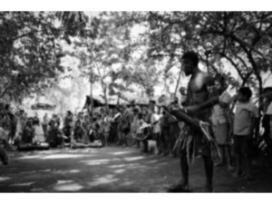A warrior dancer welcoming the first tourists to his village at Manpowa on Sanaroa Island 